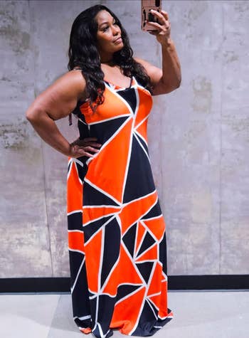 reviewer in geometric-patterned maxi dress takes a mirror selfie