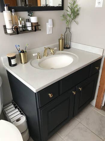 Reviewer pic of transformed bathroom vanity with the help of the spray paint