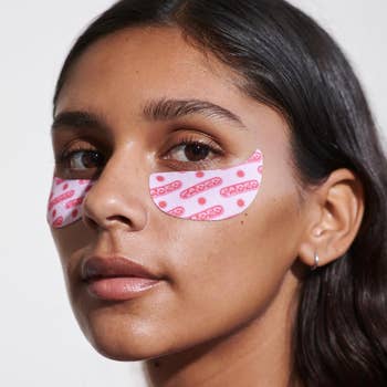 Woman with branded adhesive bandages on cheeks