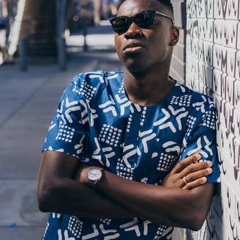 model in blue and white print shirt