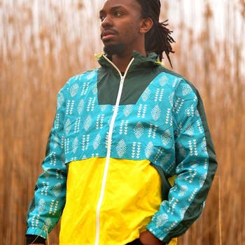 model wearing blue and yellow print windbreaker