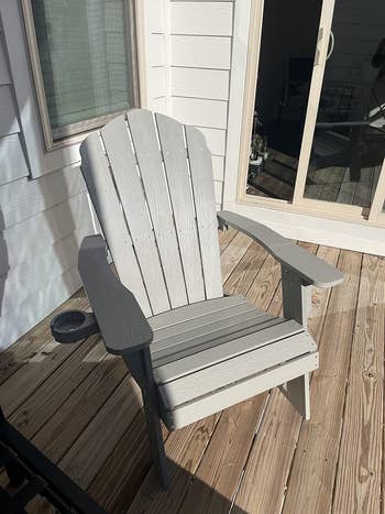 plastic grey Adirondack chair on a sunny deck