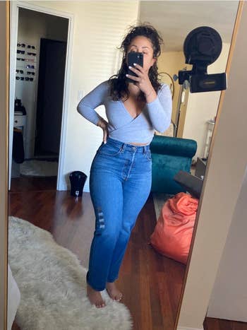 Reviewer in medium denim high waisted straight leg jeans 