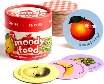 Moody Food game packaging with a stack of illustrated emotion cards, including 