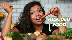 Chef Yadi takes a bite of a carrot.