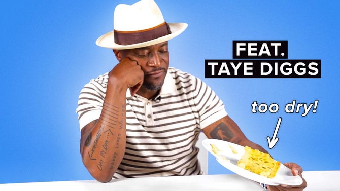 Taye Diggs frowns while wearing a white fedora and tipping a plate with a cube of mac n cheese on it. Text reads, 