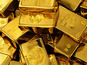 Gold holds near record high as Fed minutes fuel rate-cut bets