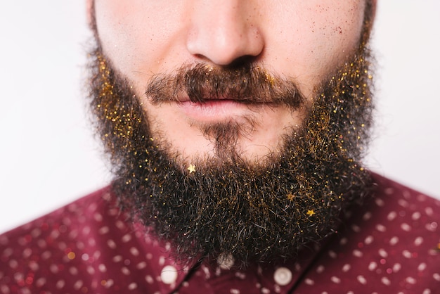 Foto gratuito barba uomo in scintillii dorati