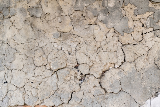 Foto grátis antigo fundo de textura de parede de concreto rachado