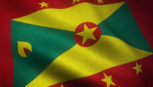 Nahaufnahmeaufnahme der wehenden Flagge von Grenada mit interessanten Texturen