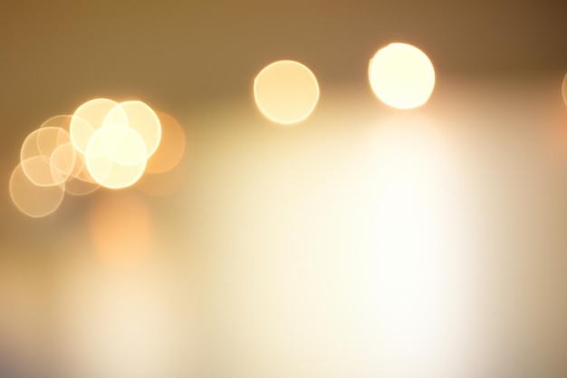 Foto abstrakte bokeh-lichter auf einem beigen hintergrund