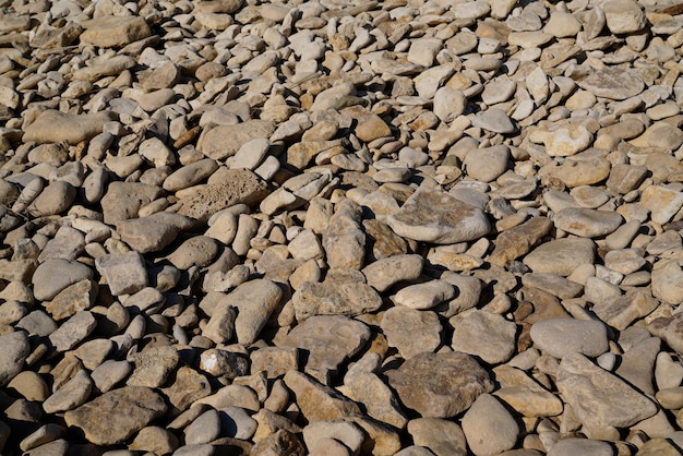 Abstrato com muitos pequenos papéis de parede de pedra de seixos de pedra