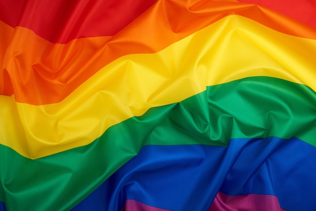 Bandeira de arco-íris de têxteis com ondas, fundo de cultura LGBT