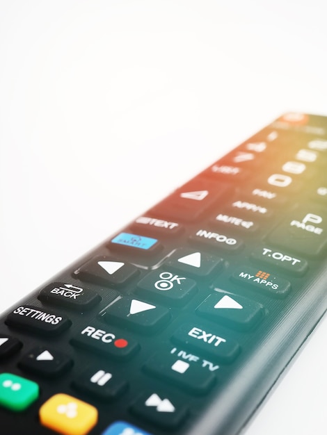 Foto controle remoto de tv, botões de close-up, peças de controle remoto coloridas.