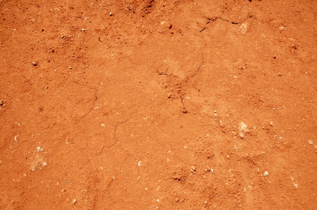 Foto fundo de textura do solo vermelho, argila seca