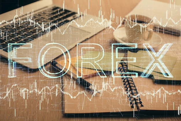 Foto mehrfachbelichtung der forex-grafikzeichnung und des desktops mit kaffee und gegenständen auf dem tischhintergrund konzept des finanzmarkthandels