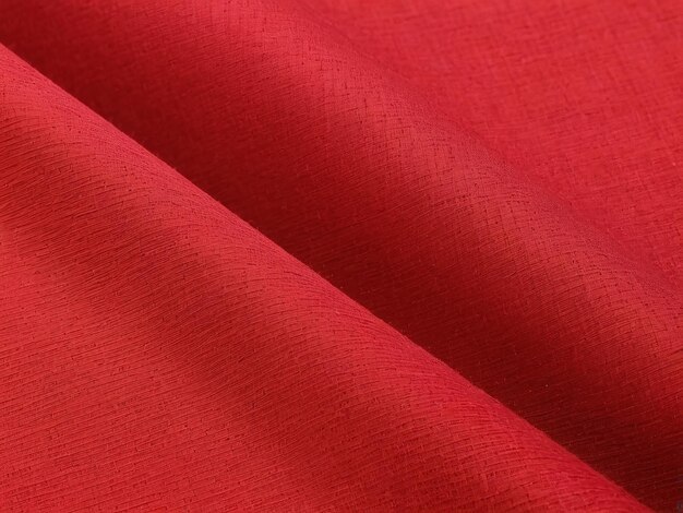 Foto roter stoff mit polyester-textur und textiler hintergrund mit roter fabirc-textur