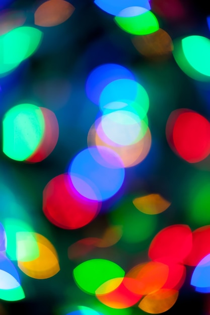 Textura bokeh de luzes multicoloridas de natal e ano novo