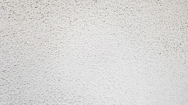 Textura da parede de concreto. Fundo de parede de estuque branco. Parede de cimento pintado de branco. Parede e piso de concreto branco como textura de fundo. Loft no estilo de idéias de design de um edifício residencial.