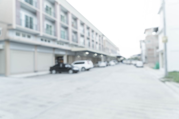 Free photo abstract blur image of road with a car and house in the village.