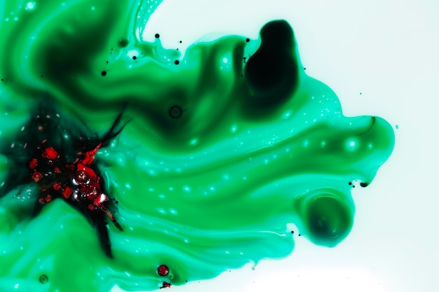 Abstract red figure on green slime