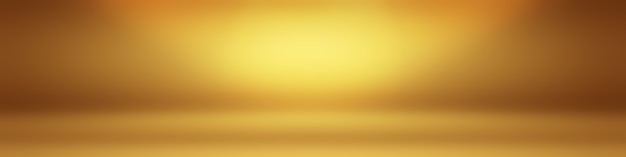 Free photo abstract solid of shining yellow gradient studio wall room background.