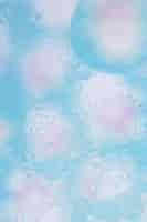 Free photo abstract watercolor background with bubbles