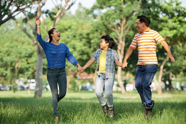 Free photo adorable family having fun at park