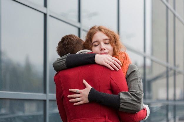 Free photo adorable women hugging with passion