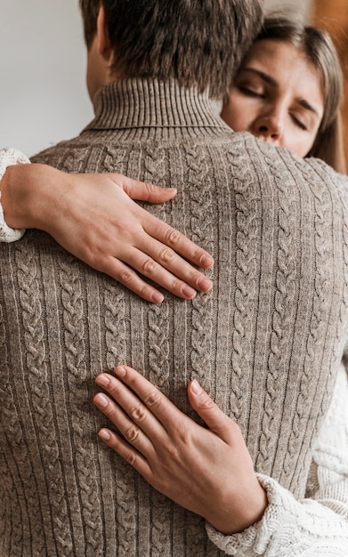 Free photo adult woman hugging her husband