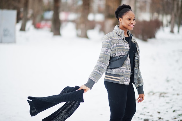 Free photo african woman wear in black scarf pose in winter day at europe