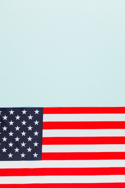 Free photo american flag on light blue surface