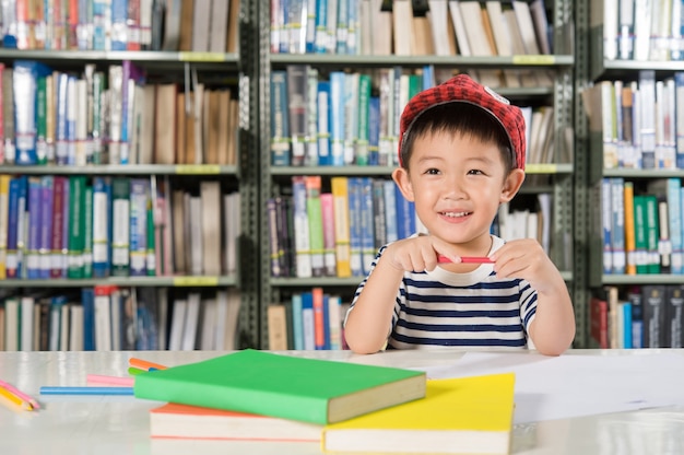 Free photo asian boy in library room school