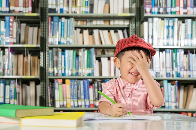 Free Photo asian boy in library room school