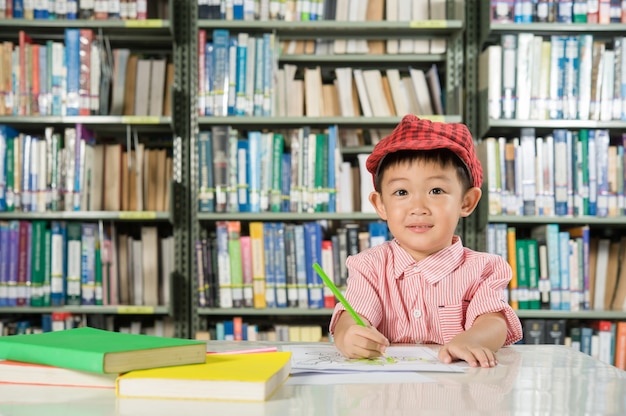 Free Photo asian boy in library room school