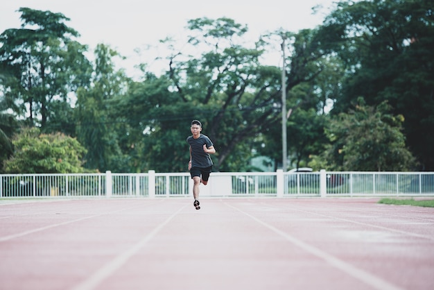 Free photo athlete standing on an all-weather running track