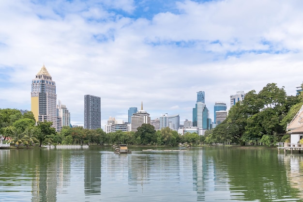 Free photo bangkok business district cityscape from a park with blue sky