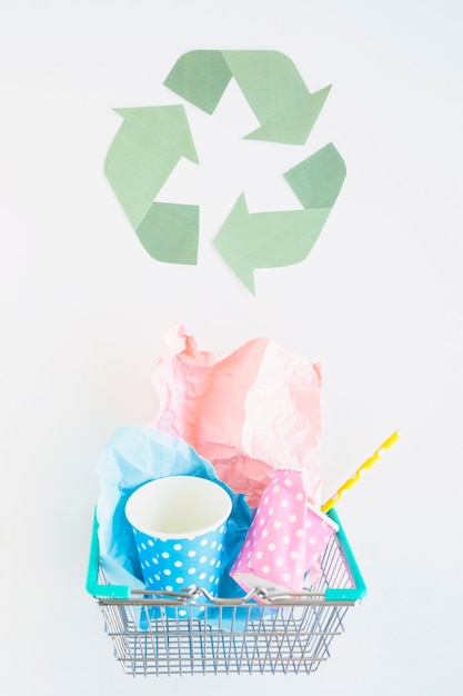 Free photo basket with paper trash and recycle logo