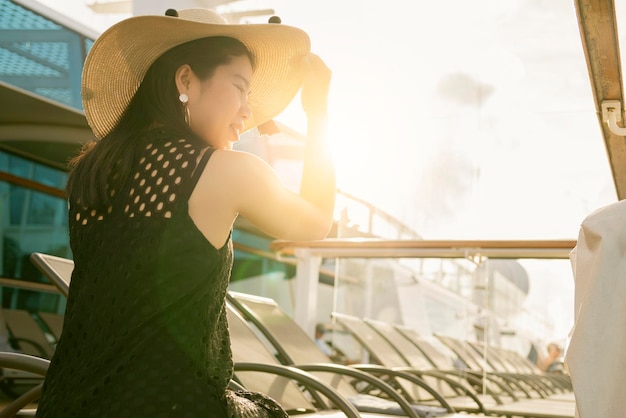 Free photo beautiful asian female woman relax casual leisure peaceful moment on cruise deck vacation summer time