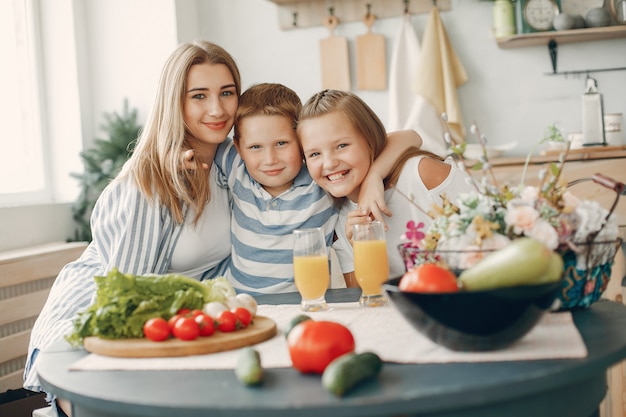 Free photo beautiful big family prepare food in a kitchen