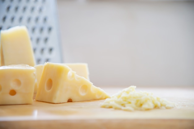 Free photo beautiful cheeses in the kitchen - cheese food preparing concept