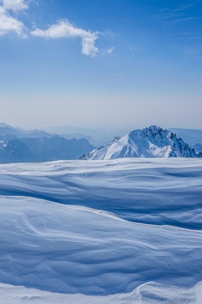 Free photo beautiful shot of high white hilltops and mountains covered in fog