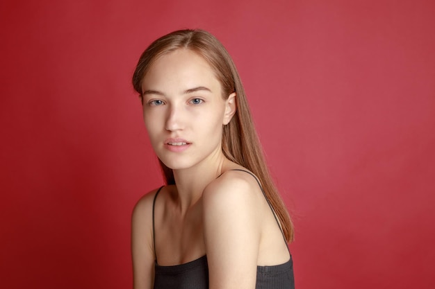 Free Photo beautiful smiling young woman with perfect skin face natural beauty concept isolated on studio background