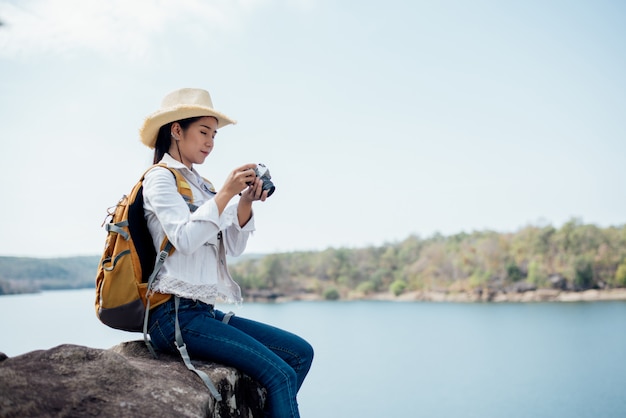 Free Photo beautiful woman traveler photographing temples