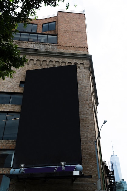 Free photo big billboard template on building in city