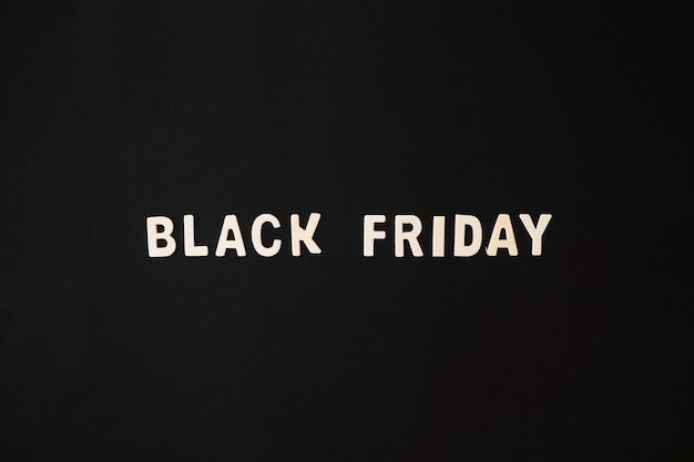 Free photo black friday inscription from wooden table