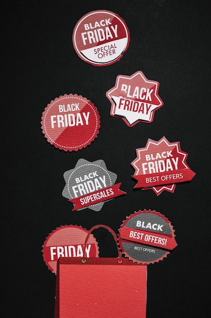 Free photo black friday stickers and red paper bag