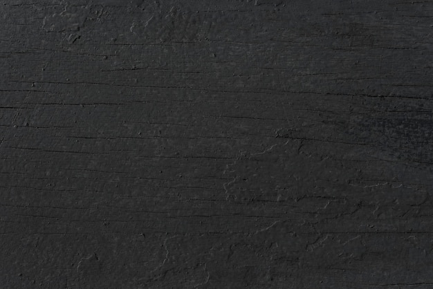 Free photo black wooden textured background design