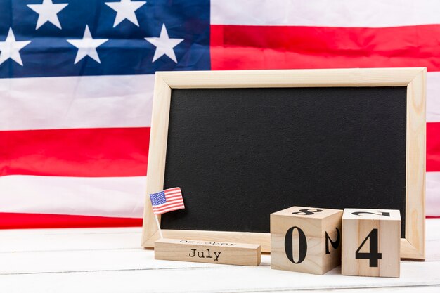 Blackboard and wooden cubes with date of independence day of America 