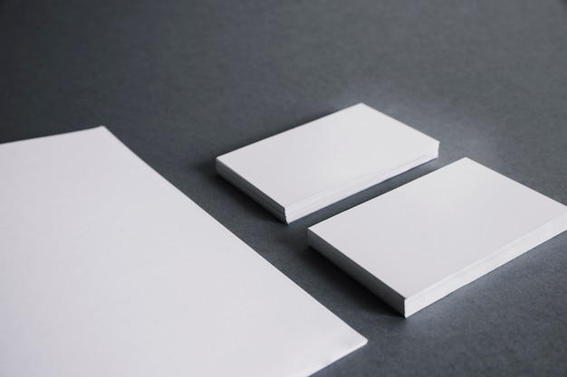 Free Photo blank stationery concept with two stacks of business cards